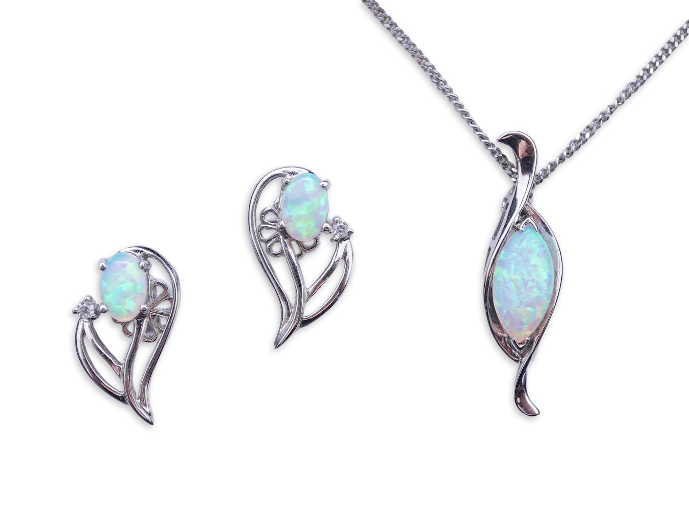 A synthetic opal demi-parure